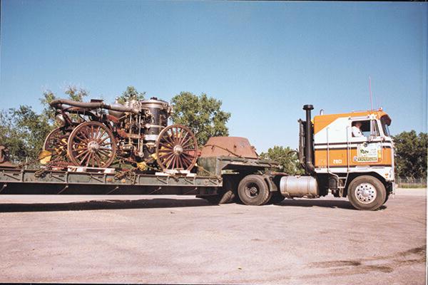 Hauling an old fire wagon pumper on a single-drop trailer.